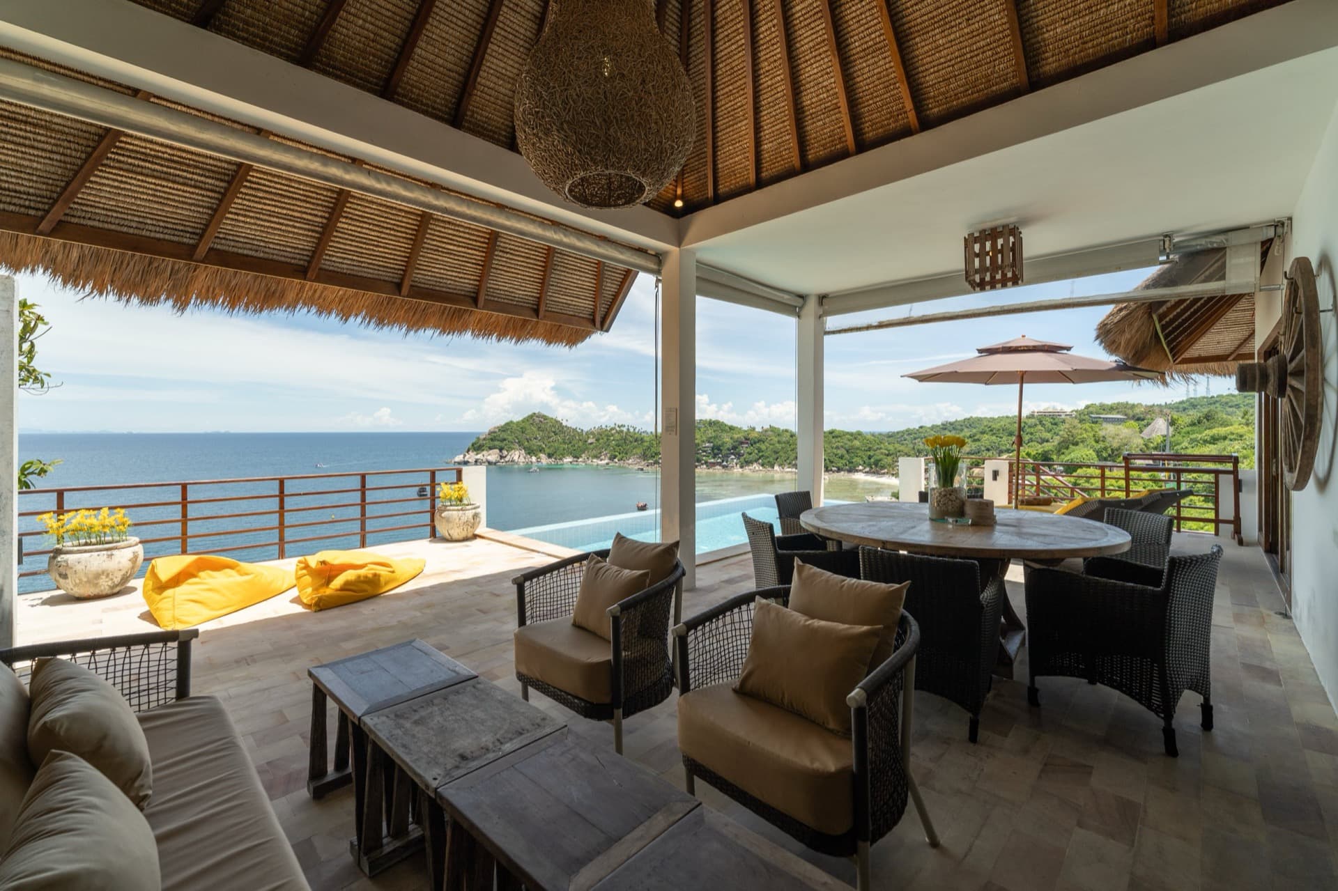 Gecco Villa terrace lounge and dining area beside the infinity pool